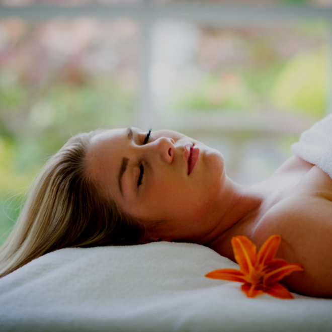 Lady relaxing after a treatment darkened