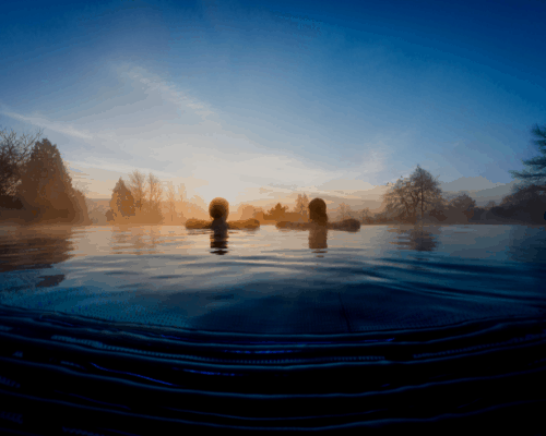 Two Ladies enjoying Twilight from the Rooftop Infinity Pool