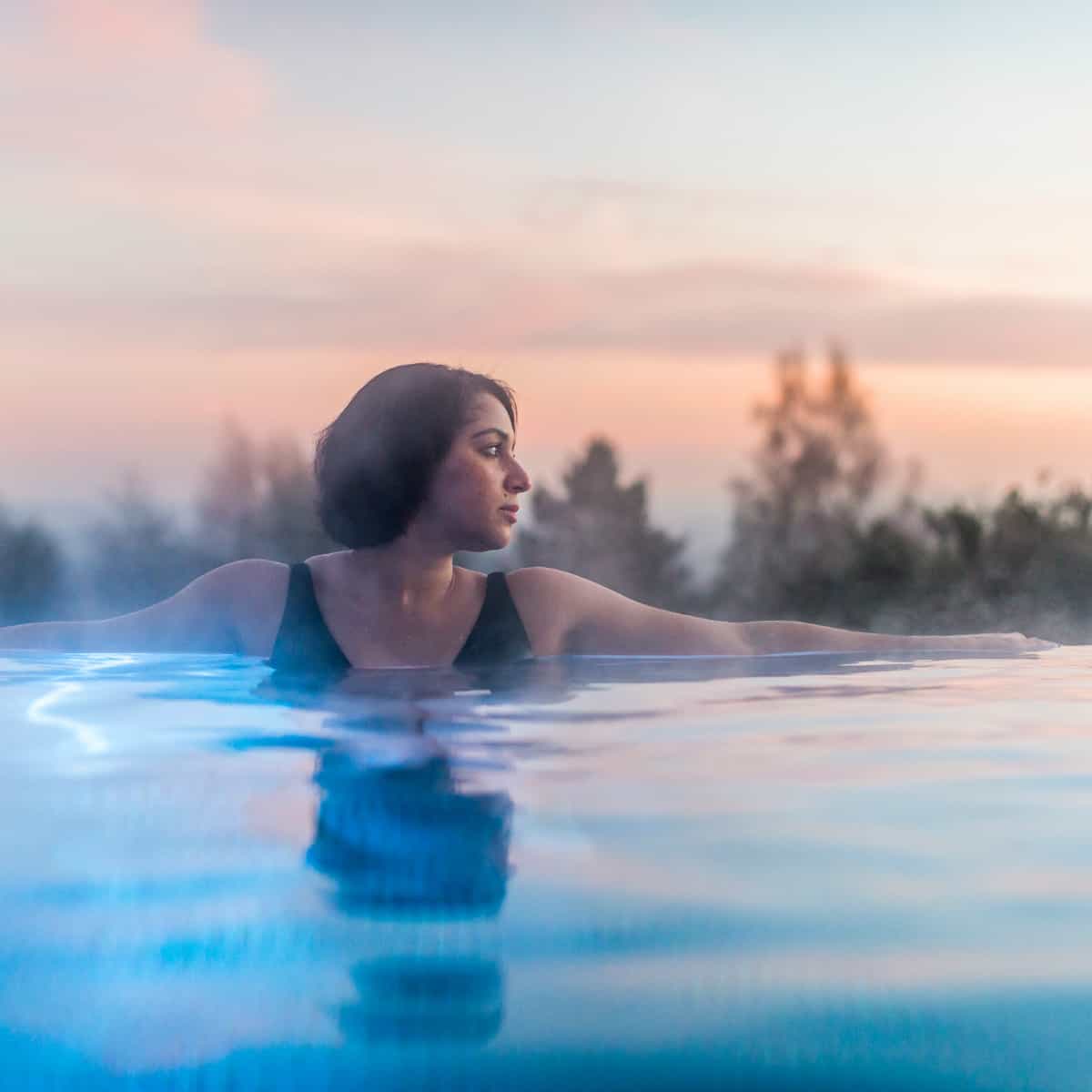 Guest relaxing in the infinity pool at Ragdale Hall