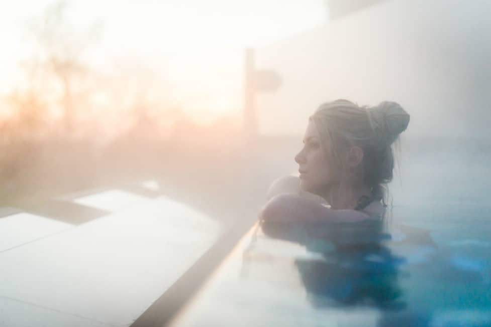 Guest enjoying the view from infinity pool at Ragdale Hall