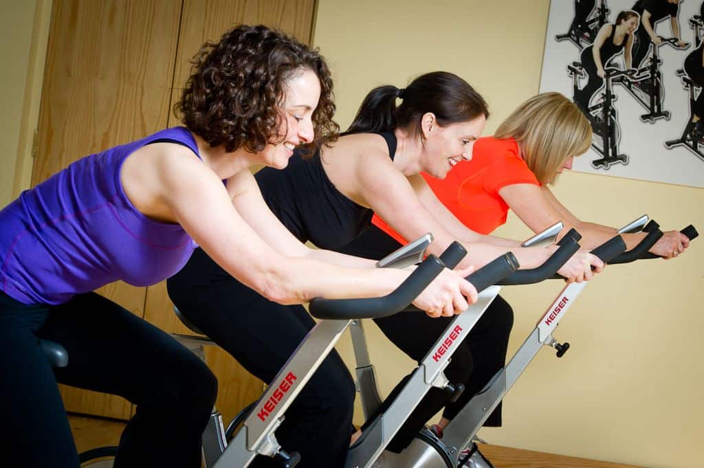 Guests participating in a spinning class