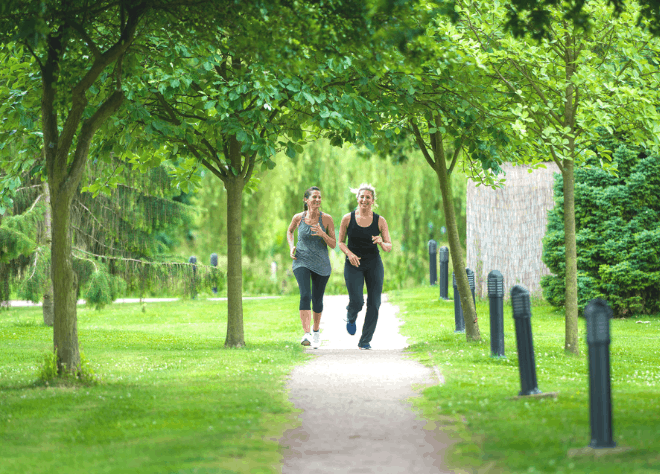 Two ladies running outside