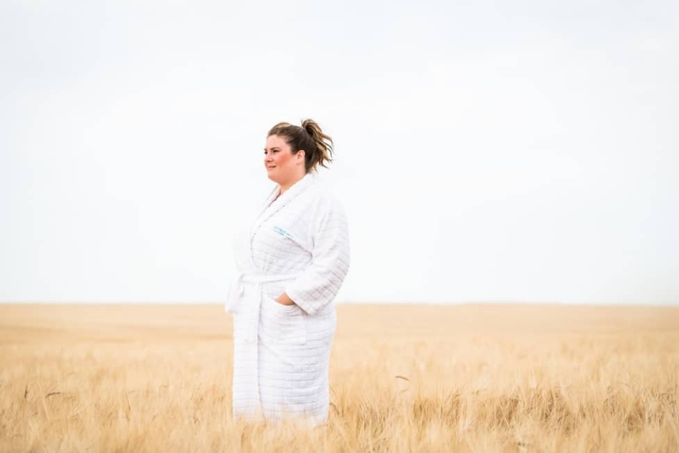 Guest having a mindful moment in the fields at Ragdale Hall