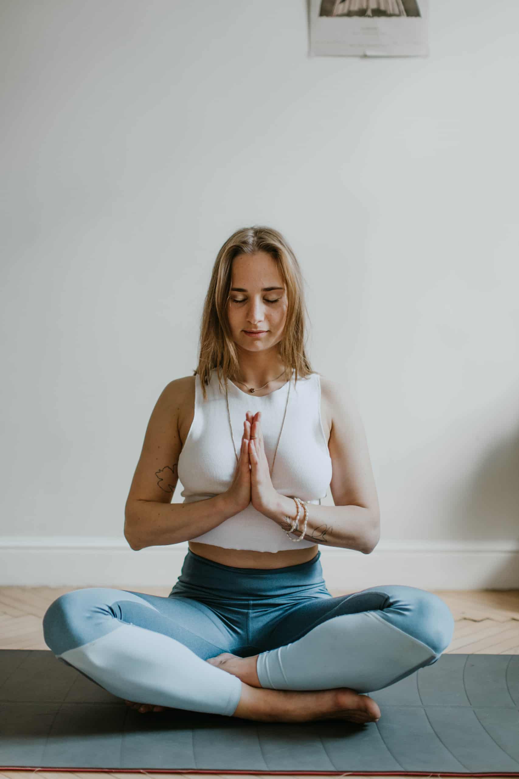 woman-doing-yoga-inside-a-room-3094215