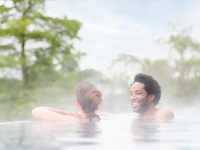 Couple-Enjoying-Rooftop-Infinity-Pool